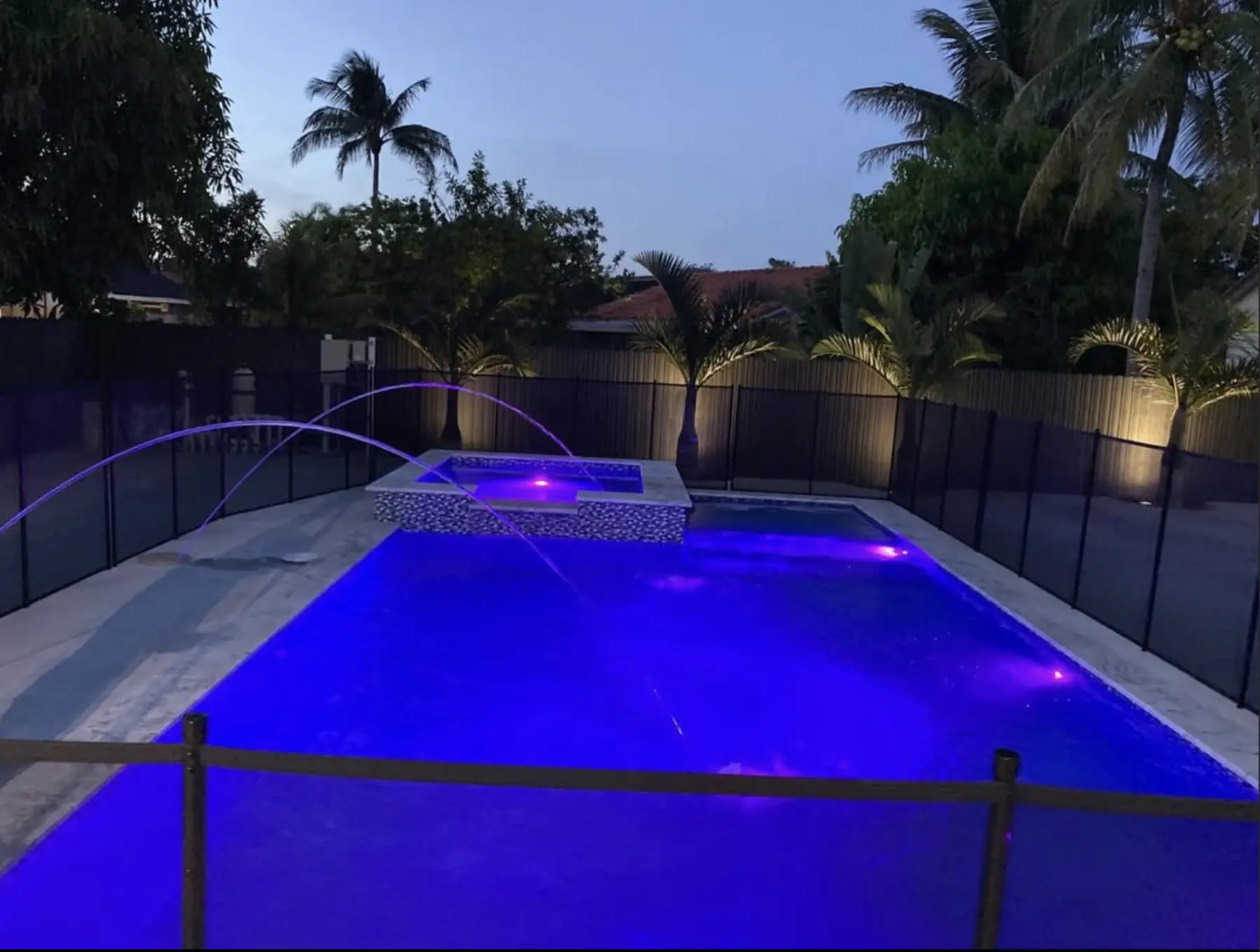Swimming pool with dramatic night lighting